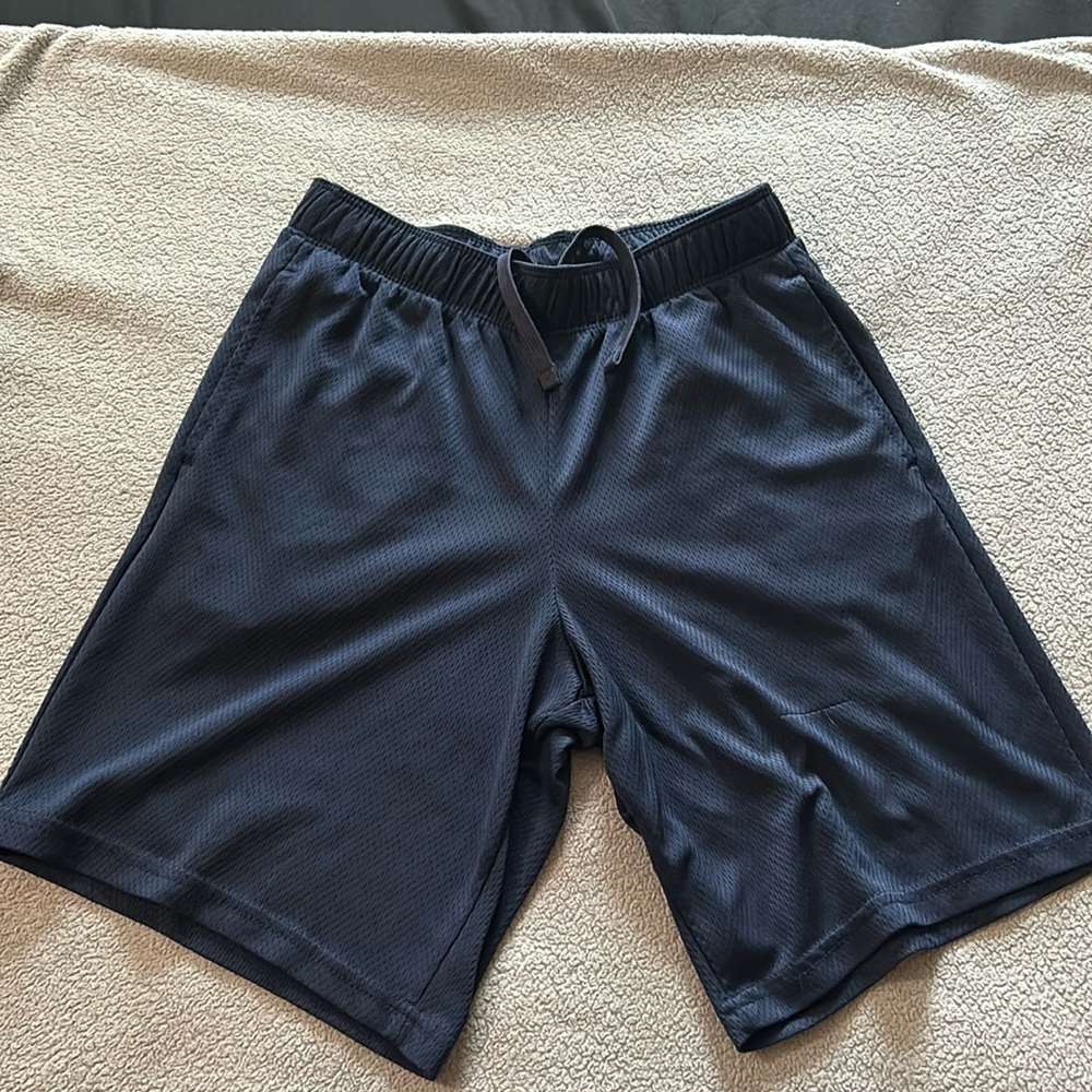 All in motion Boys blue mesh shorts. Size says 12/14 but they are closer 10/12.
